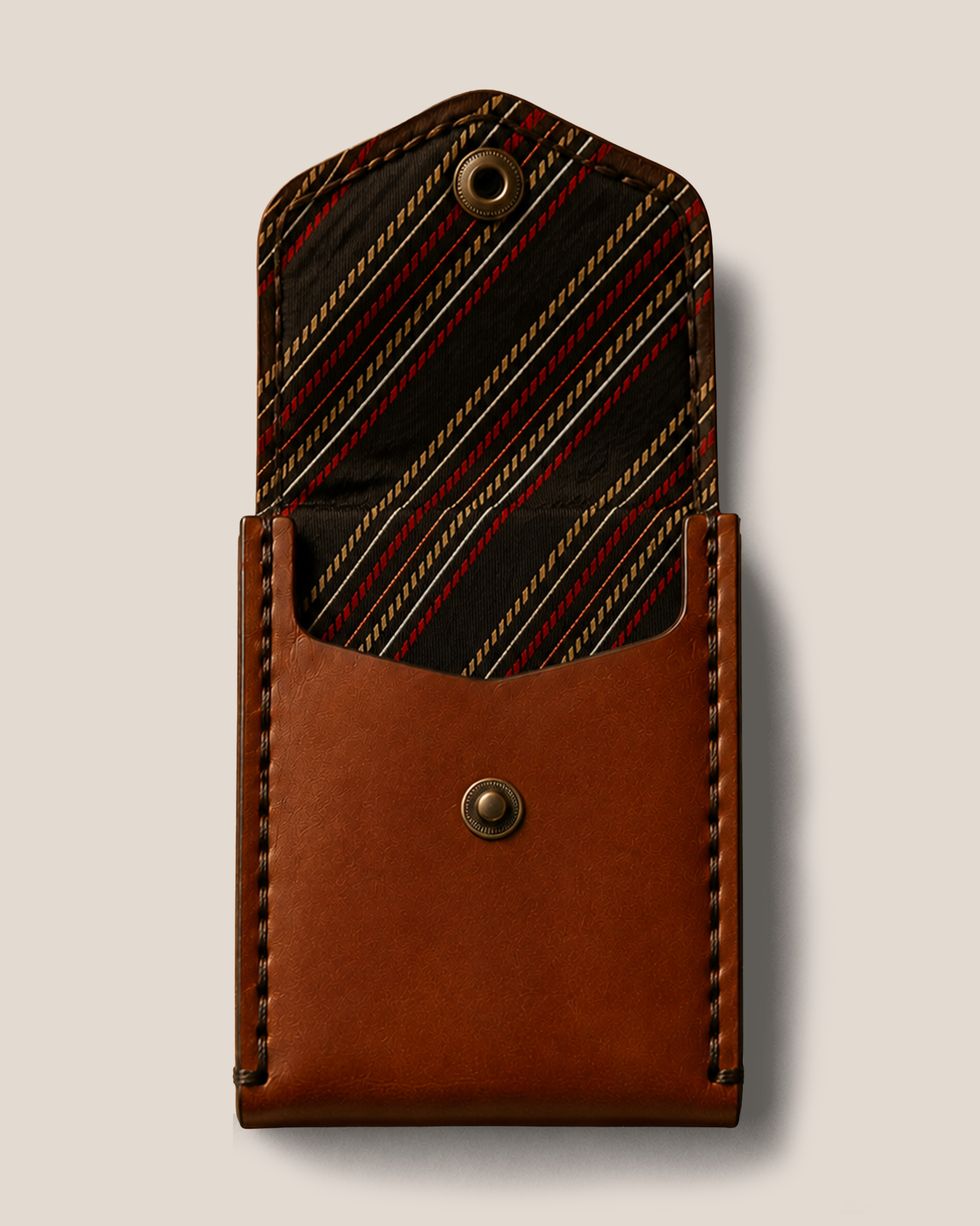 An XKv wallet open, showing its vintage necktie lining